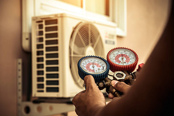 Professional Air Conditioning Service technician working in Purchase, NY